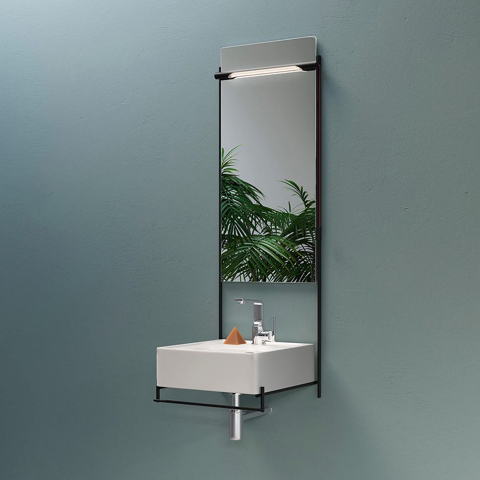 White basin with black framed mirror. 