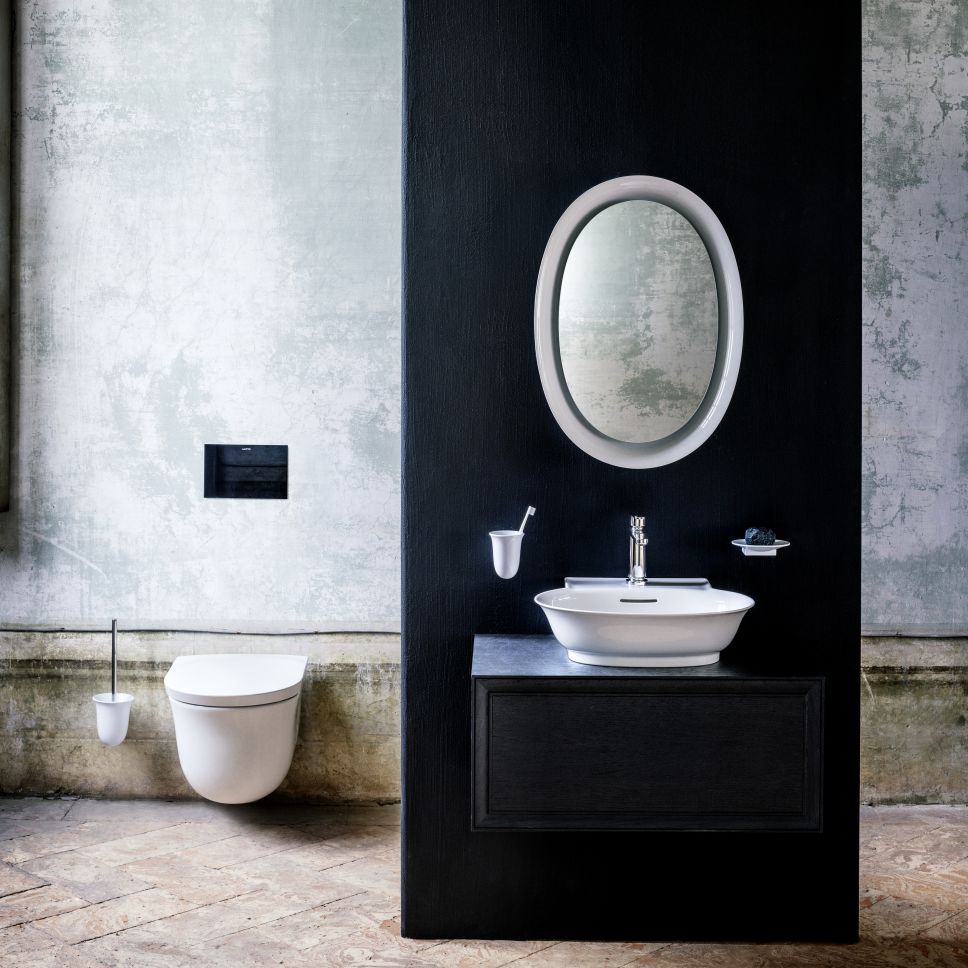 Counter top bowl with drawer element, wall hung WC and illuminated oval mirror. 