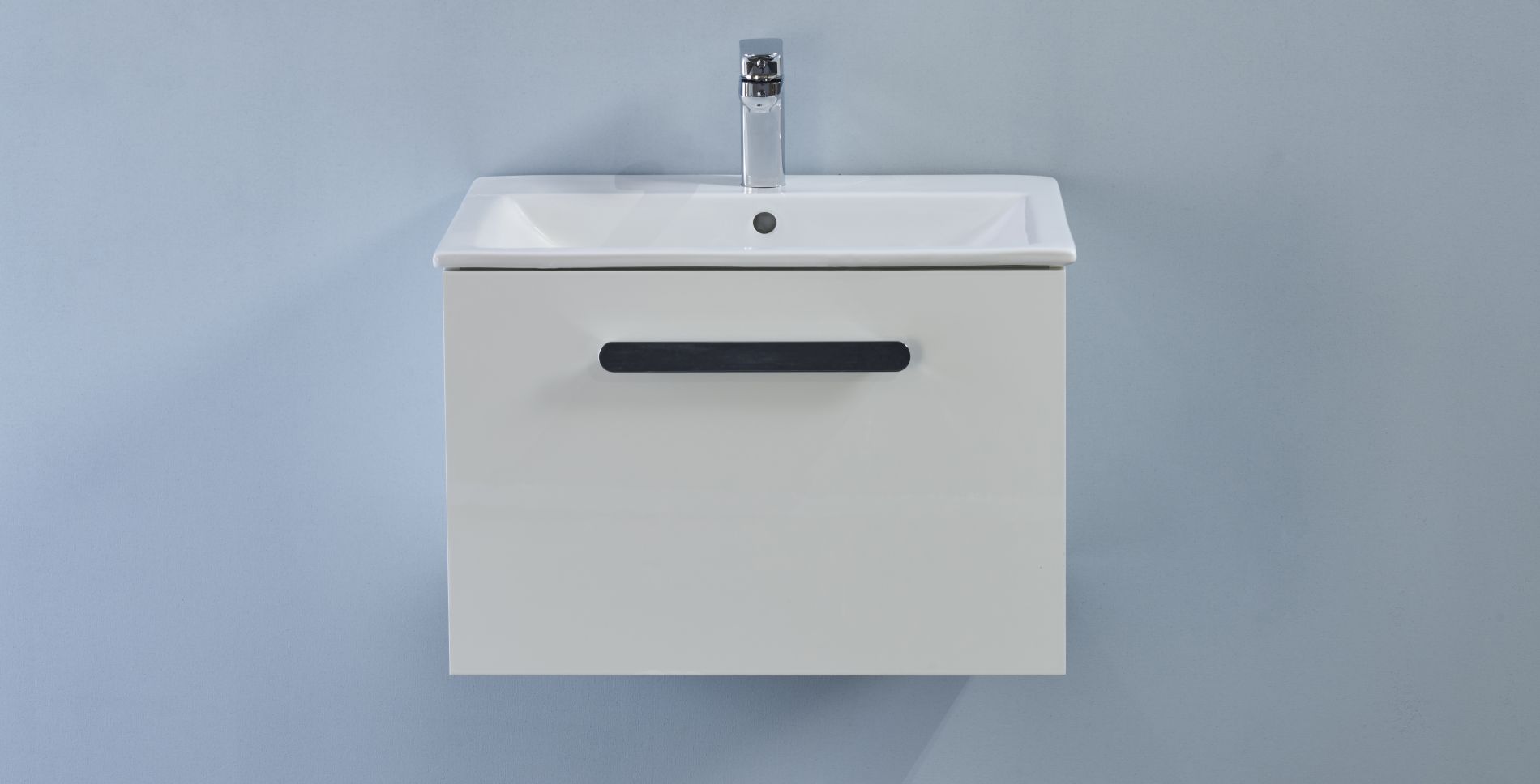 White wall hung unit with basin. 