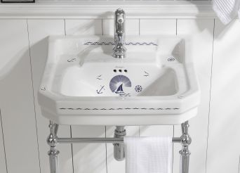 White basin with metal stand and blue detailing.  