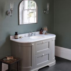 Curved vanity unit with basin. 