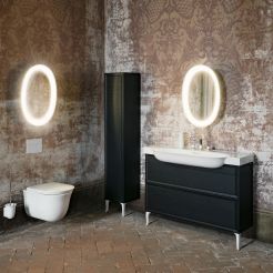 Washbasin with 2 drawer element and feet, tall unit with feet, wall hung WC and illuminated oval mirror. 