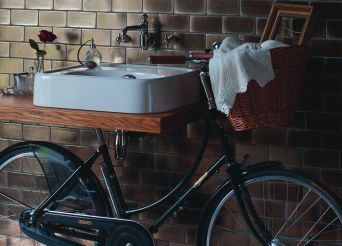 Unique basin with bicycle as stand. 